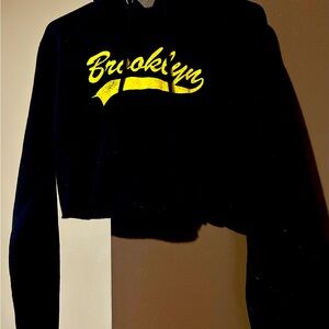 It’s a long sleeve hoodie crop top that say Brooklyn